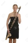 25907498-pretty-blonde-woman-in-evening-dress-with-bass-clarinet-studio-shot.jpg